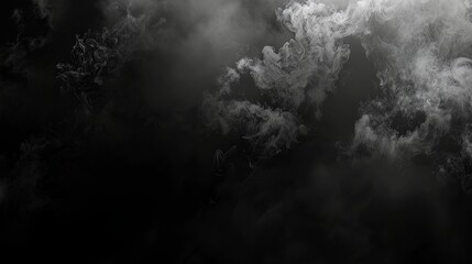 Wispy gray smoke swirling on black background