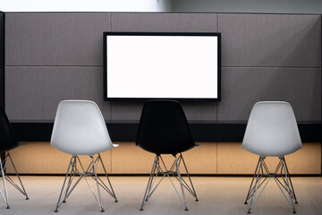 A background texture of a modern, minimalist, and professional meeting room featuring a blank white...
