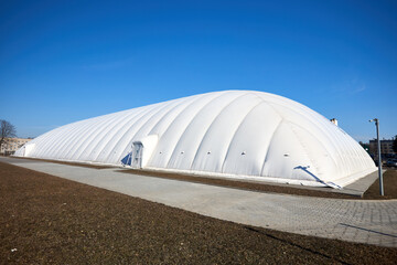 Inflatable air dome stadium. Inflated Tennis air dome or Tennis bubble arena. Modern urban architecture example as pneumatic stadium dome. © R_Yosha