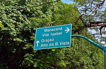 Fototapeta premium Traffic sign indicating nearby neighborhoods in Tijuca, Rio de Janeiro, Brazil