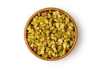 Chopped pistachio in wooden bowl on white background
