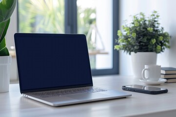 Fototapeta premium A modern workspace featuring a laptop, smartphone, coffee cup, and potted plant under natural light, ideal for remote work.