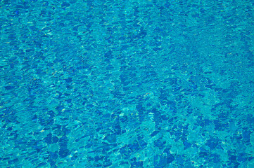 Swimming Pool Surface With Light Reflection and Water Ripple Patterns