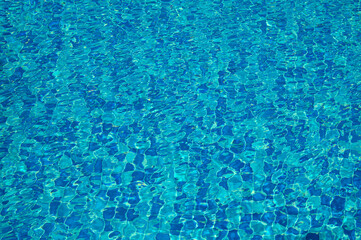 Swimming Pool Surface With Light Reflection and Water Ripple Patterns