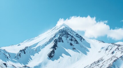 Snowy mountain peak under a clear blue sky, representing the majesty and beauty of nature.