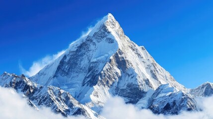 Snowy mountain peak under a clear blue sky, representing the majesty and beauty of nature.