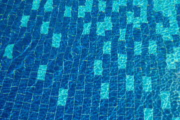 Swimming Pool Surface With Light Reflection and Water Ripple Patterns