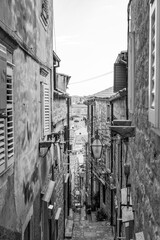 Staircased narrow cobblestone alley in the medieval old town of Dubrovnik in Dalmatia, Croatia