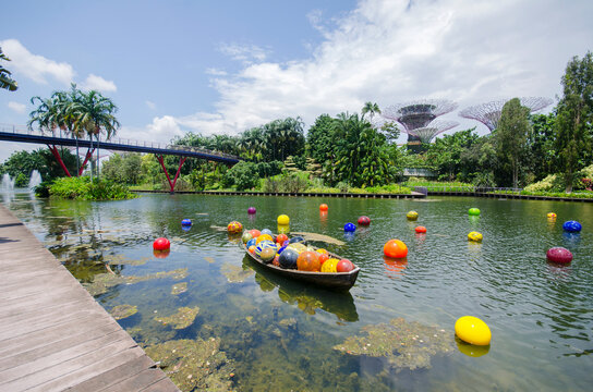 Colorful glass balls fill in a boat at the Dragonfly lake in Garden by the Bay