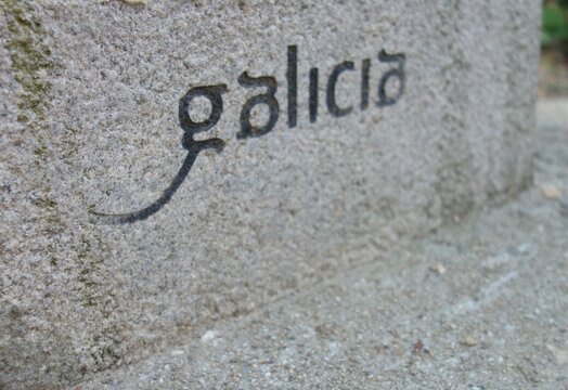 Galicia sign engraved in the stone at the end of Saint James Way, Spain