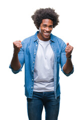 Afro american man over isolated background very happy and excited doing winner gesture with arms...