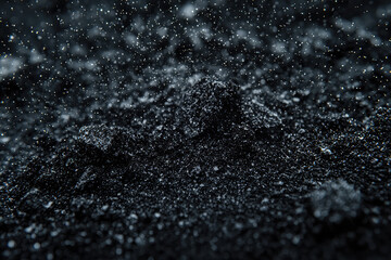 Shimmering Black Sand: A Close-Up of Nature's Tiny Treasures