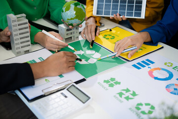 colleagues discussing data working and tablet, laptop with on Construction Site project, green...
