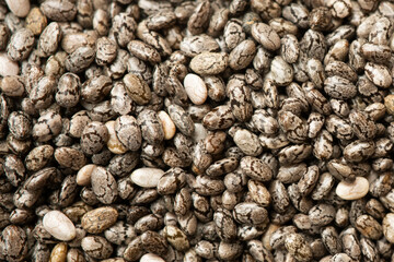 Close up photograph of chia seeds. Chia seeds contain fibre and omega-3 fatty acids, protein, many essential minerals and antioxidants. Healthy eating concept. 