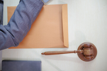 Judge gavel is placed on table in office of lawyer team It is gavel used as symbol of making...