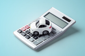 Car toy on calculator on blue backgroundCar toy on calculator on blue background, car finance,...