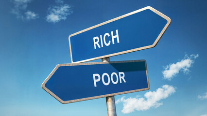 Obraz premium Two directional road signs with rich and poor options, symbolic crossroads under clear blue sky, decision-making concept, representing economic disparity and wealth inequality through signpost choice