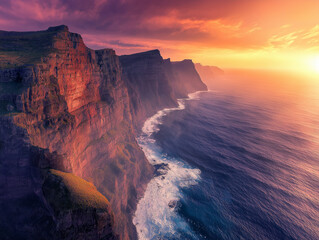 Fototapeta premium Breathtaking Aerial Shot of Dramatic Coastal Cliffs at Sunset