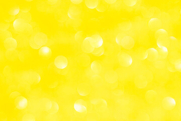 Abstract yellow bokeh background. Defocused christmas lights. Party, holiday and festive concept