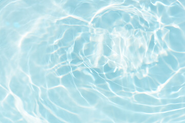 Blue water with ripples on the surface. Defocus blurred transparent blue colored clear calm water...