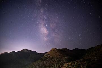 night panoramic landscape with starry sky on the island of Crete in Greece in August