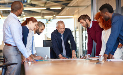 Collaboration, meeting and planning with business people in boardroom of corporate workplace together. Conversation, documents or laptop for teamwork with man and woman employee group in office