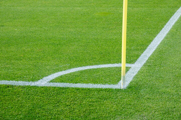Obraz premium Corner flag in a soccer stadium. Flag on the corner of a football field. Empty football soccer field