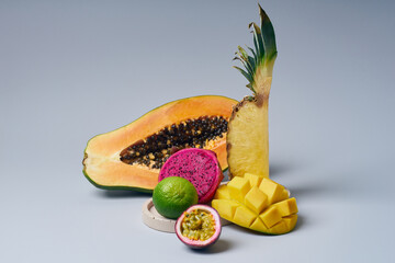 Tropical fruits variety on a colorful background. Side view with copy space
