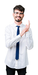 Young handsome business man wearing glasses over isolated background Clapping and applauding happy and joyful, smiling proud hands together