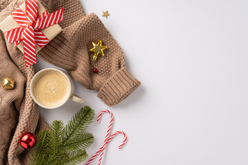 Warm holiday season image featuring a cozy sweater, coffee, gift, candy canes, and festive decorations