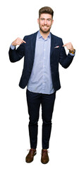 Young handsome bussines man looking confident with smile on face, pointing oneself with fingers proud and happy.