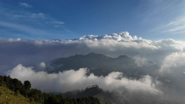 4k video footage of Prau Mountain panorama with blue sky and white clouds in Dieng, Wonosobo, Indonesia. Concept for International Day of Forest, World Environment Day.