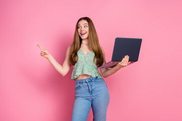 Photo of nice young girl laptop direct finger empty space wear top isolated on pink color background