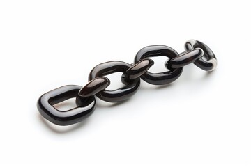 Obraz premium Close up of a shiny metallic chain link on a white surface