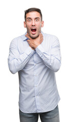 Handsome young businessman shouting and suffocate because painful strangle. Health problem. Asphyxiate and suicide concept.