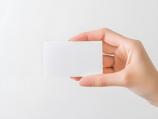 Obraz premium Hand Holding Blank White Business Card Mockup