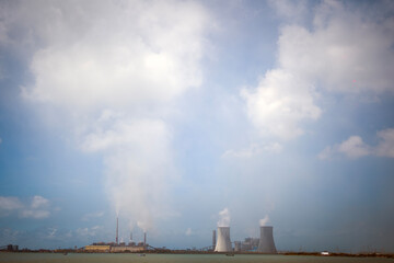 A serene ocean scene during sunset or sunrise. The cloud formations add depth and contrast to the scene,giving a dynamic feel to the otherwise tranquil moment. The sky dominates the image, showcasing 