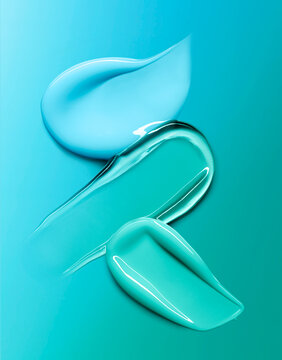 Cream cosmetic anti aging  texture stroke composition isolated on blue green background. Hyaluronic acid skincare moisturizer product