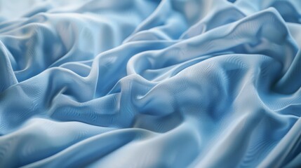 Obraz premium Soft folds of light blue fabric create a serene and elegant texture, reminiscent of gentle waves or silk drapery.