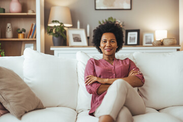 Confident Woman Relaxing on a Comfortable Sofa at Home