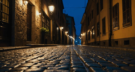 Naklejka premium Cobblestone street under dim streetlights background