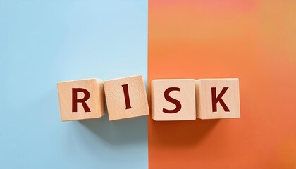 Wooden blocks spell the word 'RISK' against a vibrant split background, symbolizing risk management and decision making.
