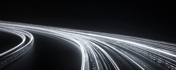 A minimalist design featuring thin white light trails dancing across a black background, creating simple yet striking curves.
