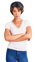 Young beautiful woman wearing casual clothes skeptic and nervous, disapproving expression on face with crossed arms. negative person.