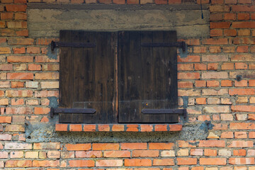 brick wall with a window in the middle