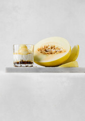 dessert of melon in a glass with honey