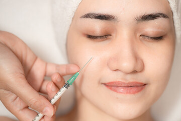 Woman needle injection facelift. Medical Filler for face lifting remove wrinkles in facial spa skin care clinic process.