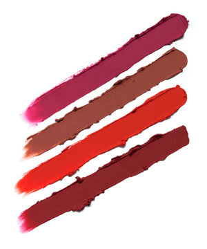 Pink red matte lipstick striped texture composition isolated on white background. Cosmetic product smear smudge swatch