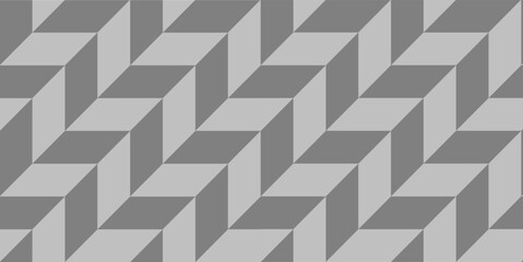 Seamless geometric pattern with alternating light and dark gray tiles in a dynamic herringbone layout. A clean, modern design perfect for backgrounds or interior decor inspiration.