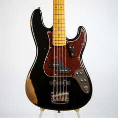 Close up shot of a bass guitar standing fine detailed proffessional bass guitar